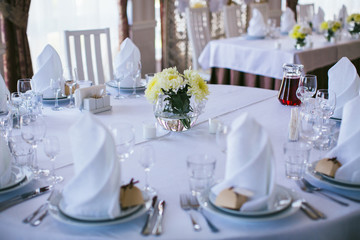 bouquet in a glass vase on a wedding table