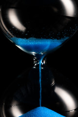 blue retro hourglass to measure time