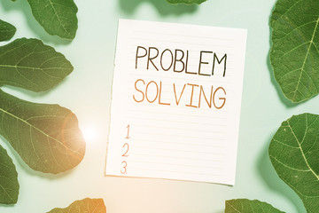 Conceptual hand writing showing Problem Solving. Concept meaning process of finding solutions to difficult or complex issues Leaves surrounding notepaper above empty soft pastel table