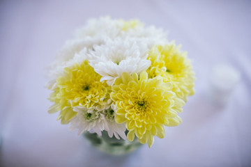 bouquet in a glass vase on a wedding table