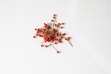 pile of red pins