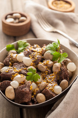 Braised meat with vegetables and mushrooms.