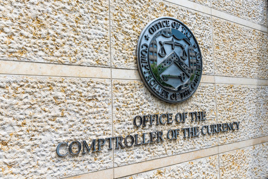 Washington DC, USA - July 3, 2017: Office of the Comptroller of Currency sign and logo in downtown