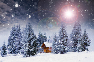 Wooden cottage in a fairy-tale winter landscape.