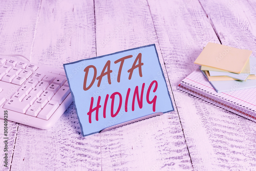 Fototapete Word writing text Data Hiding. Business photo showcasing Secretly embedding data in graphics images and other file types Notepaper stand on buffer wire in between computer keyboard and math sheets