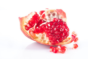 ripe and delicious pomegranate on white