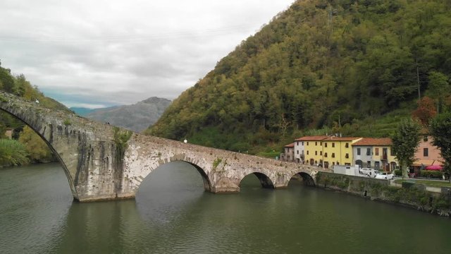 Aerial overhead view of Devils Bridge-Ponte della Maddalena is a bridge crossing the Serchio river near the town of Lucca