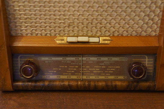 Photography of retro broadcast radio receiver. Listen music concept. Vintage instagram old style filtred photo.