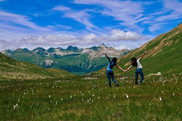 summer alpine landscape with girls
