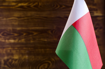 Fragment of the flag of the Republic of Madagascar in the foreground space for text blurred...