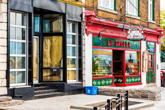 Quebec City, Canada - May 29, 2017: La Grolla Swiss restaurant store on street with sign and architecture in old town Saint Jean Baptiste area