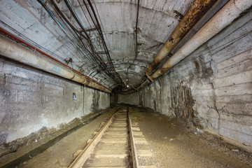 Gold iron mine ore shaft tunnel drift with rails underground