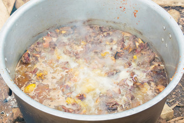 Traditional cooking process in a village in Uganda