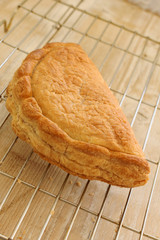 Traditional English Cornish pasty filled with meat and potatoes