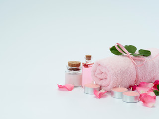 Fototapeta na wymiar Spa set of rose oil and scented candles