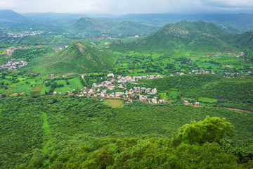 Top view of beautiful city of lakes, udaipur on the rainy day from sajjangarh fort, the top peak of the city build by king of rajasthan, India 