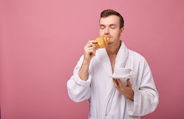 Perky cool guy sniffs fragrant pastries