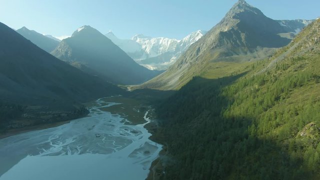 Akkem Lake and Altai Mountains in Summer Morning. Russia. Aerial View. Drone Flies Sideways and Upwards