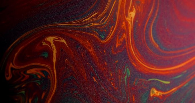 Macro shot: Surface of the soap film and the movement of rainbow streaks due to diffraction and interference of light. 4k. Slow motion