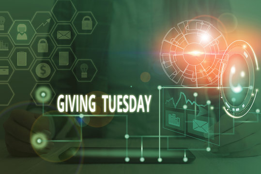 Conceptual hand writing showing Giving Tuesday. Concept meaning international day of charitable giving Hashtag activism Picture photo network scheme with modern smart device
