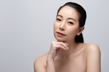 Portrait of beautiful young asian woman clean fresh bare skin concept. Asian girl beauty face skincare and health wellness, Facial treatment, Perfect skin, Natural make up. Isolated on gray background