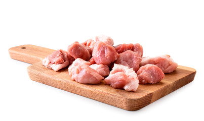 Pieces of raw meat on a kitchen shelf on a white background. Isolated