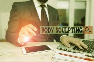 Conceptual hand writing showing Body Sculpting. Concept meaning activity of increasing the body s is visible muscle tone Male human wear formal clothes present use hitech smartphone