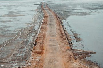View of the road in between the White Desert of Kutch, Gujarat, India
