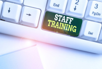 Handwriting text Staff Training. Conceptual photo program that helps employees learn specific knowledge White pc keyboard with empty note paper above white background key copy space