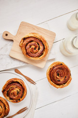 Fresh danish pastry with raisins on wood background.Tasty sweet bakery.
