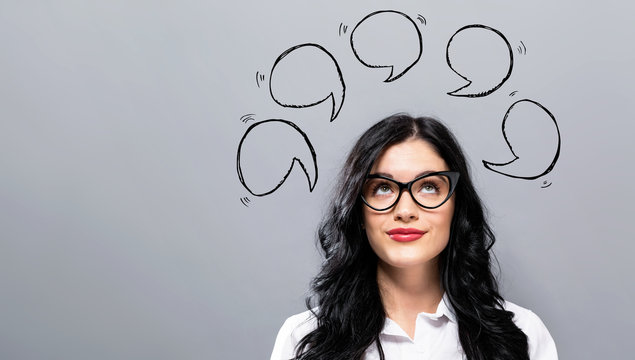 Speech bubbles with young businesswoman in a thoughtful face