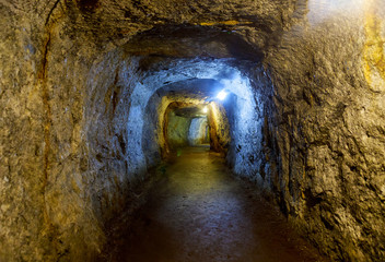 Mine underground tunnel with lights