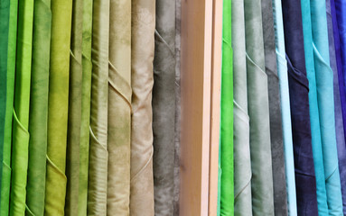 shelf full of many fabric textile