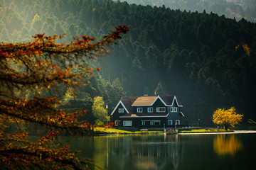 Golcuk National Park Bolu Turkey. Autumn wooden Lake house inside forest in Bolu Golcuk National...