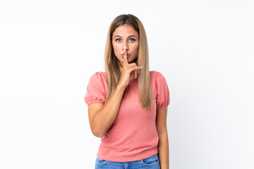 Young blonde woman over isolated white background showing a sign of silence gesture putting finger in mouth