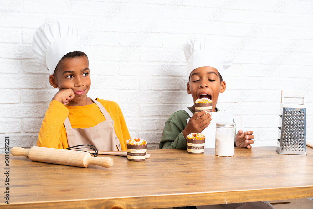 Poster Two African American brothers kids dressed as chef