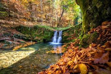 Beautiful waterfall at the mountain in autumn landscape