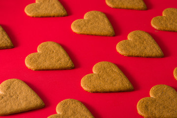 Heart shaped cookies pattern isolated on red background. Valentine's Day and Mother's Day concept.	