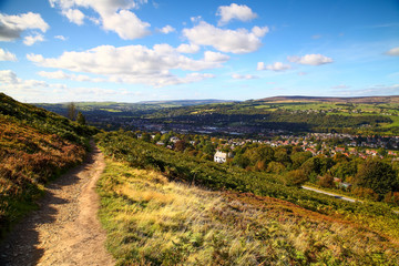 Fototapeta na wymiar Path running along ilkley moor and a view of ilkley town