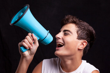 teenager shouting with megaphone