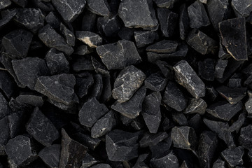 Crushed gravel texture background, background made of a closeup of a pile of crushed stone, pile of pebbles, Gravel stone background or texture, stones rubble and gravel.