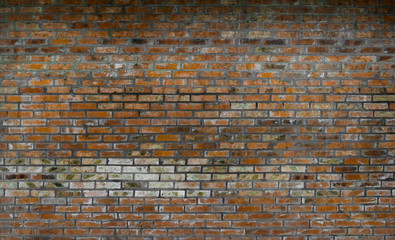 Red weathered old brick wall texture background.
