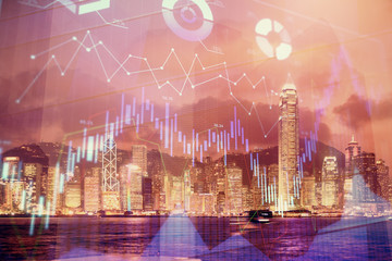 Multi exposure of forex chart drawings over cityscape background. Concept of success.