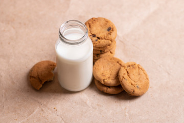 Homemade cookies and glass of milk on table close up
