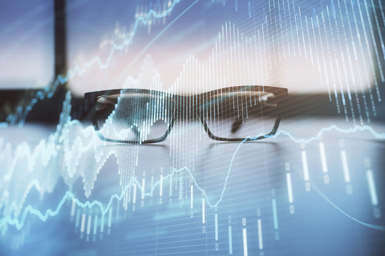 Financial graph hologram with glasses on the table background. Concept of business. Double exposure. - Powered by Adobe