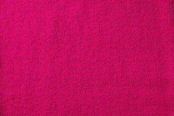 Bright pink knitted fabric background, copy space for text, top view