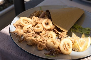 Cartoccio containing fried shrimp