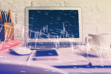 Forex market graph hologram and personal computer on background. Double exposure. Concept of investment.