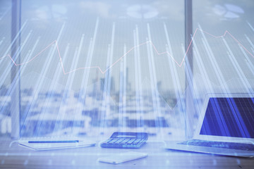 Financial chart drawing and table with computer on background. Double exposure. Concept of international markets.