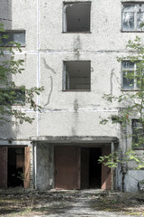 The ruins of residential buildings, the dark trash of collapsed houses as a result of the economic crisis and earthquake. The interior of the old buildings is destroyed.